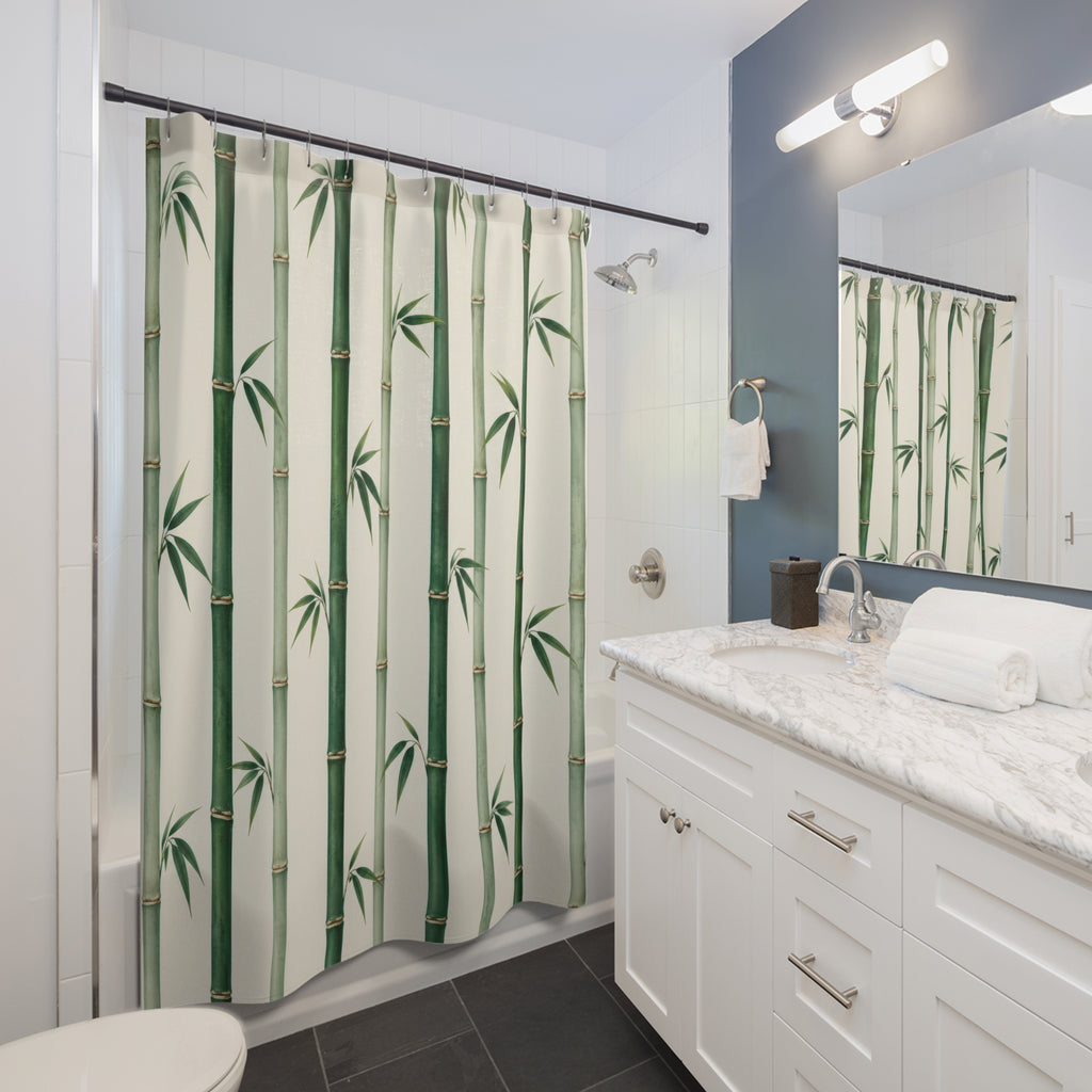 Green bamboo canes and small leaf fans on ivory shower curtain beside a white vanity