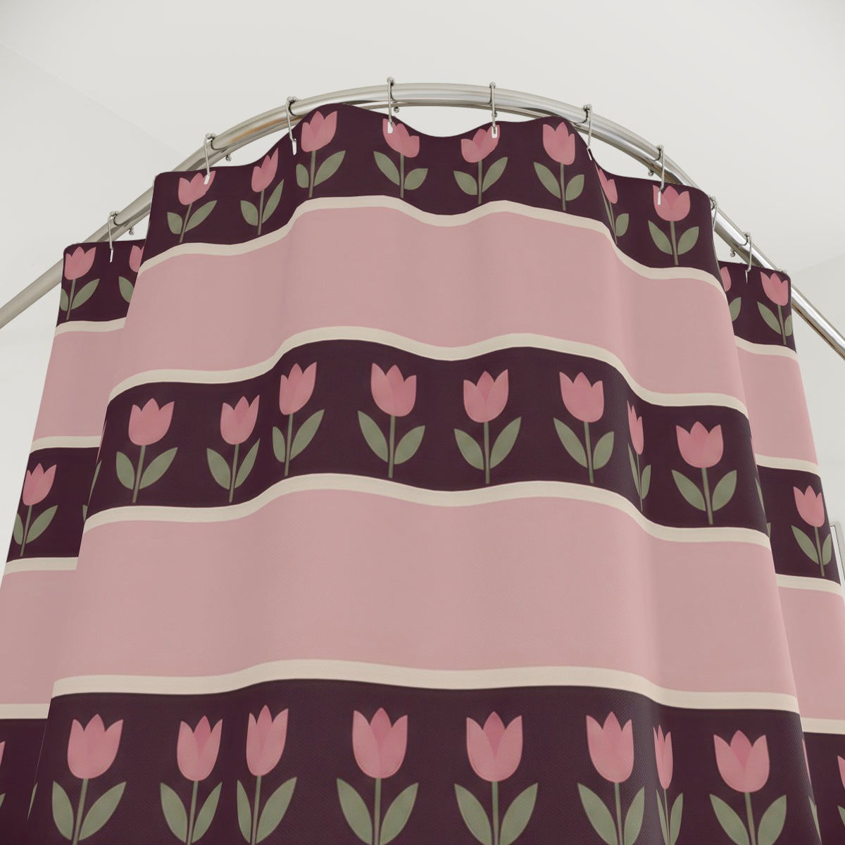 Pink tulip rows on plum bands between broad blush stripes shower curtain with close-up print, hooks, and folds
