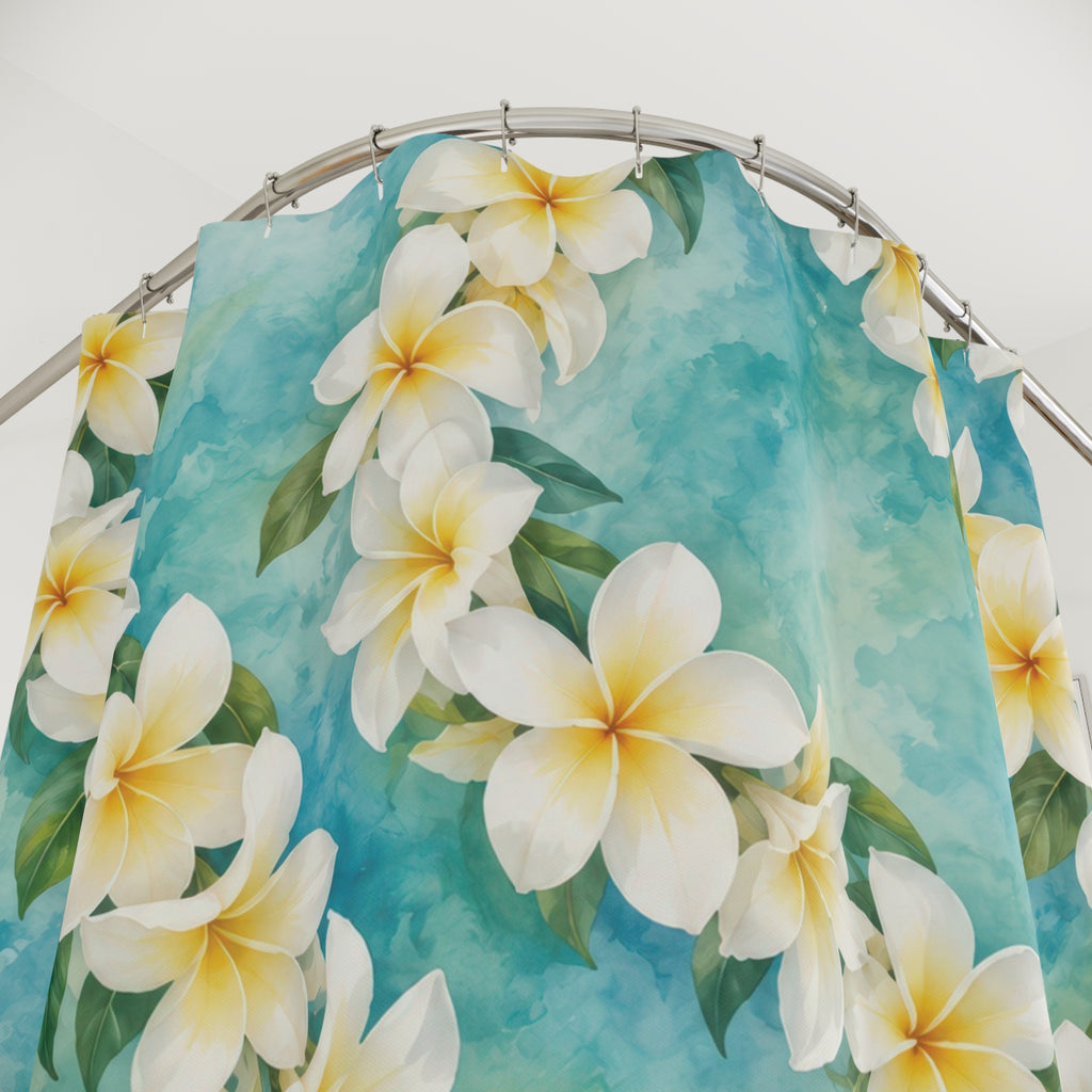 White plumeria leis over aqua watercolor shower curtain with close-up print, hooks, and folds