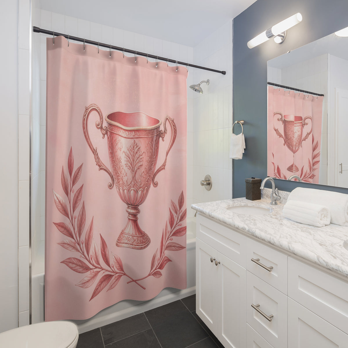 Ornate blush pink trophy cup framed by laurel branches shower curtain beside a white vanity