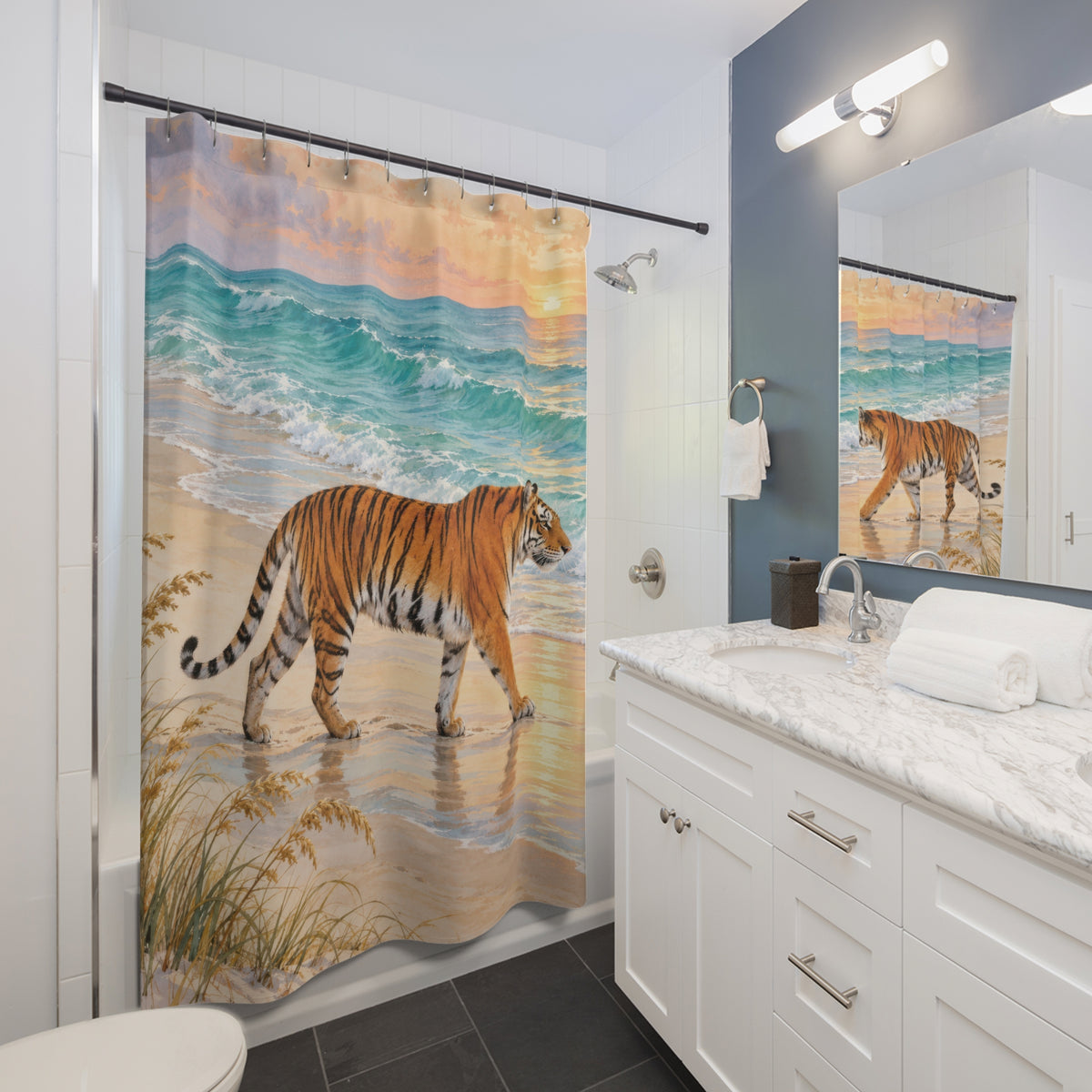 Orange tiger on golden sand beside turquoise surf shower curtain beside a white vanity