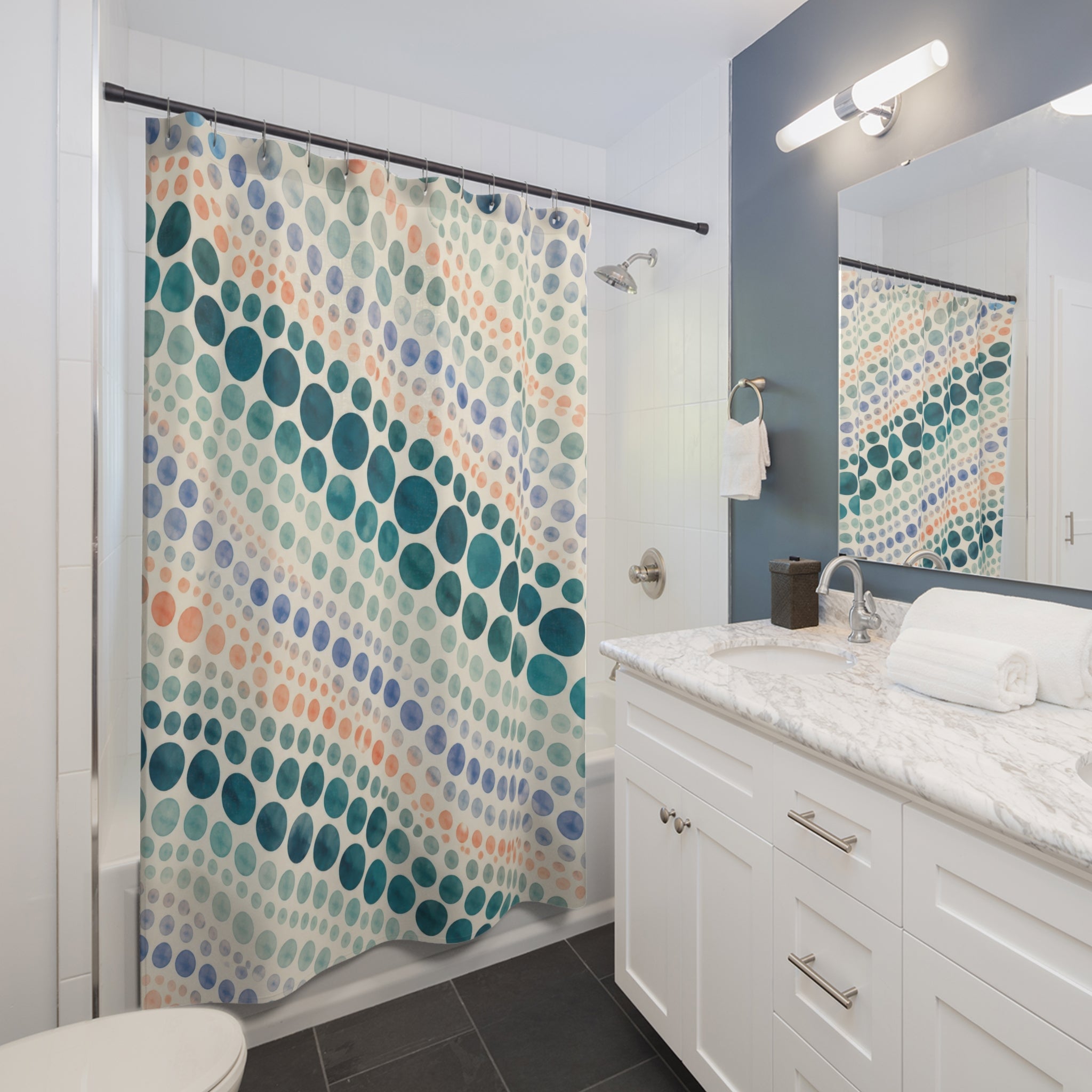Teal watercolor polka dots in diagonal rows shower curtain beside a white vanity
