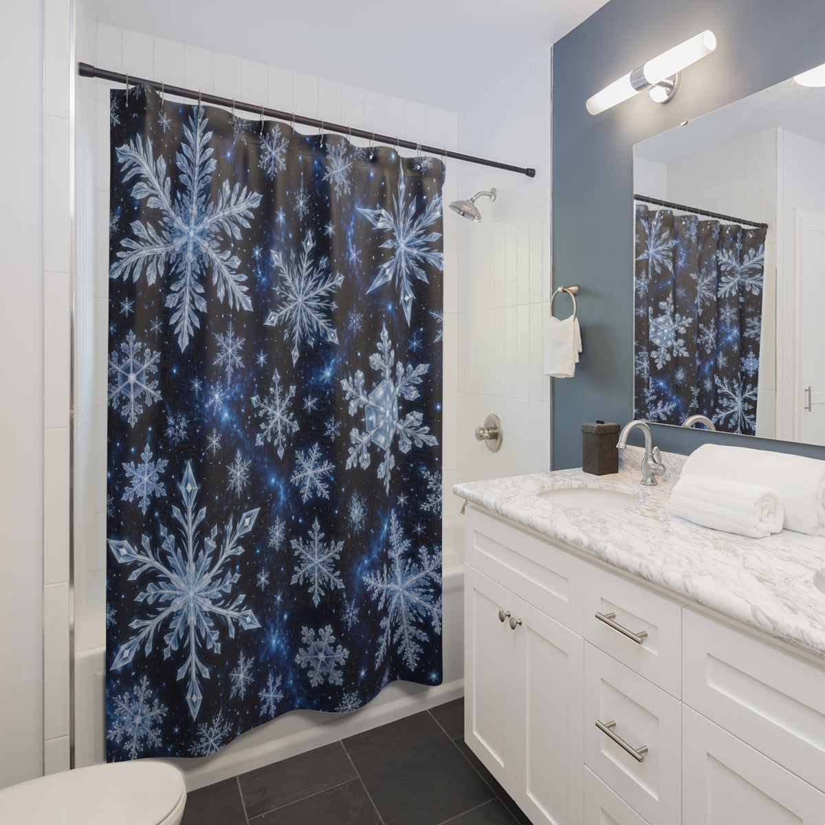 White snow crystals on deep navy shower curtain beside a white vanity