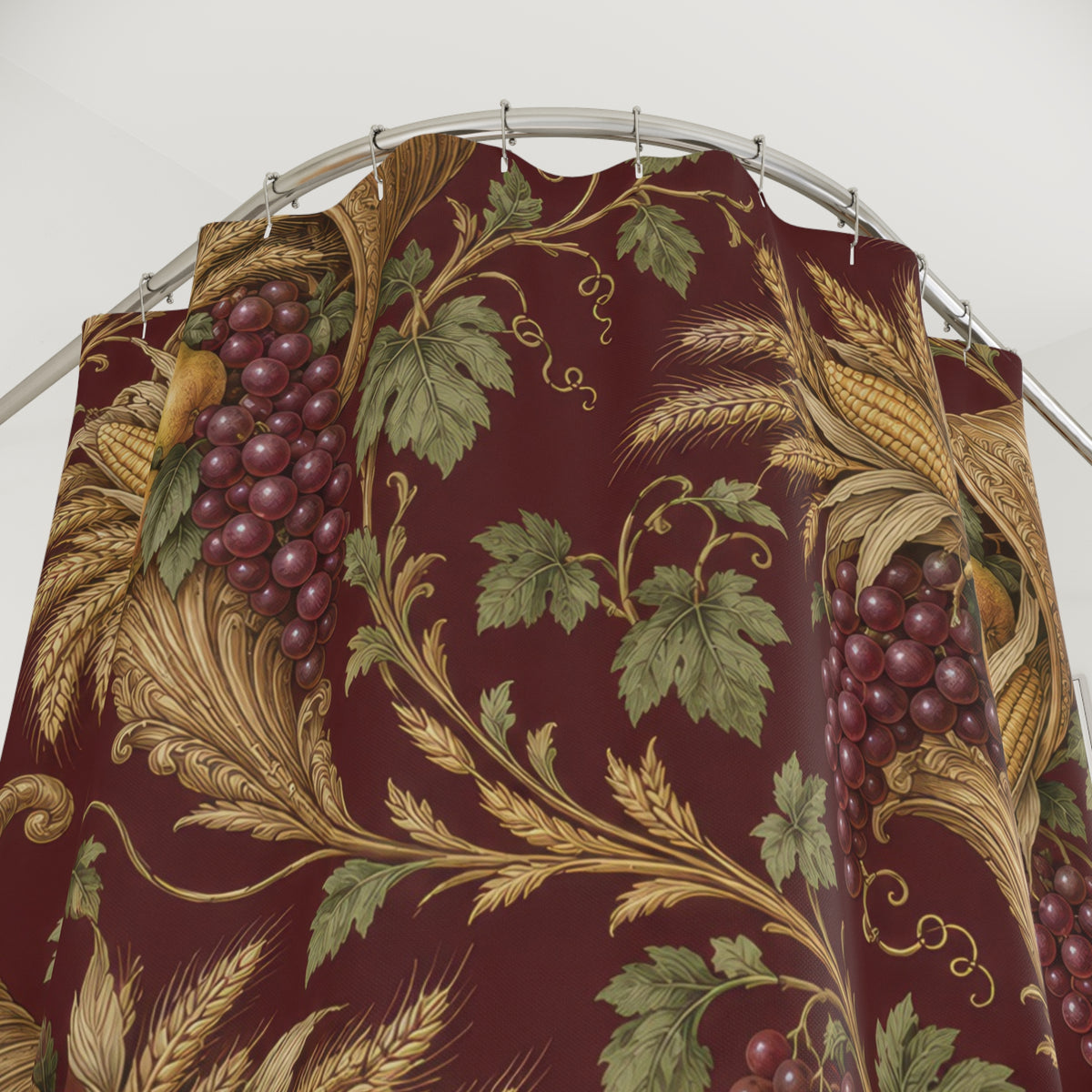 Gold cornucopias with pears and grapes on burgundy shower curtain with close-up print, hooks, and folds
