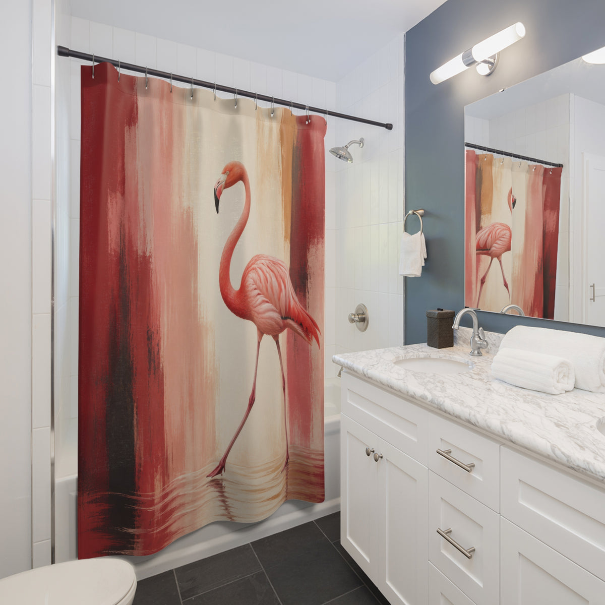 Flamingo stepping through crimson and blush painted bands shower curtain beside a white vanity