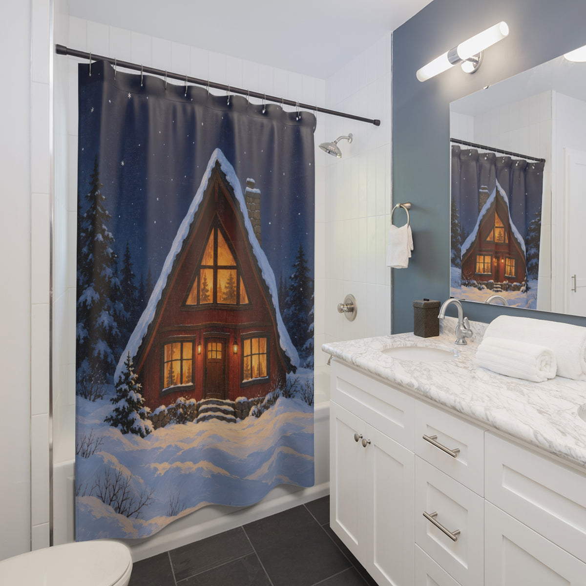 Snowy red A-frame cabin with amber windows shower curtain beside a white vanity