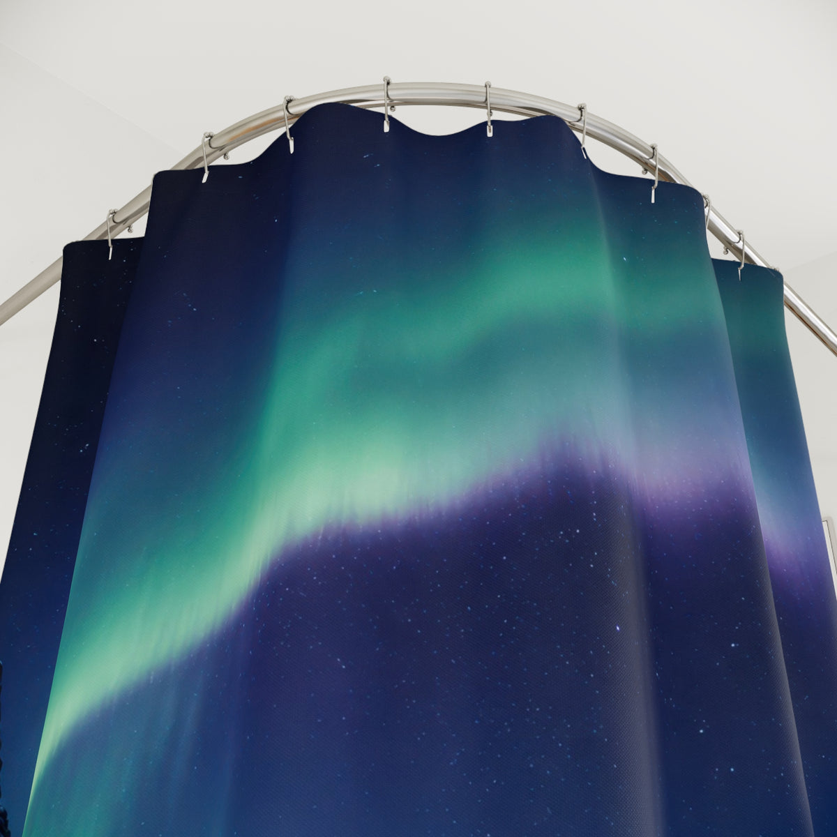 Emerald aurora above a frozen fjord and snowy cliffs shower curtain with close-up print, hooks, and folds