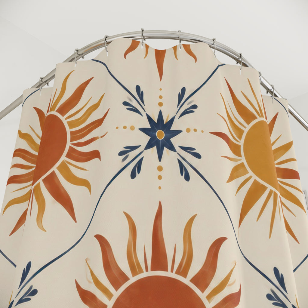 Terracotta and ochre suns with indigo stars on cream shower curtain with close-up print, hooks, and folds