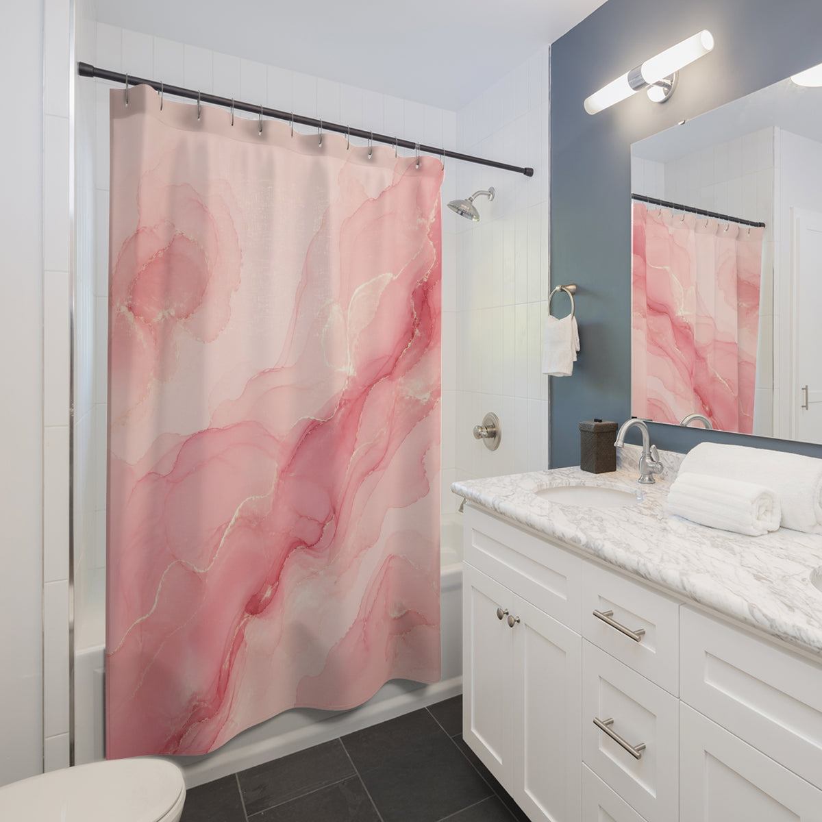 Flowing blush pink ink with rose and ivory swirls shower curtain beside a white vanity