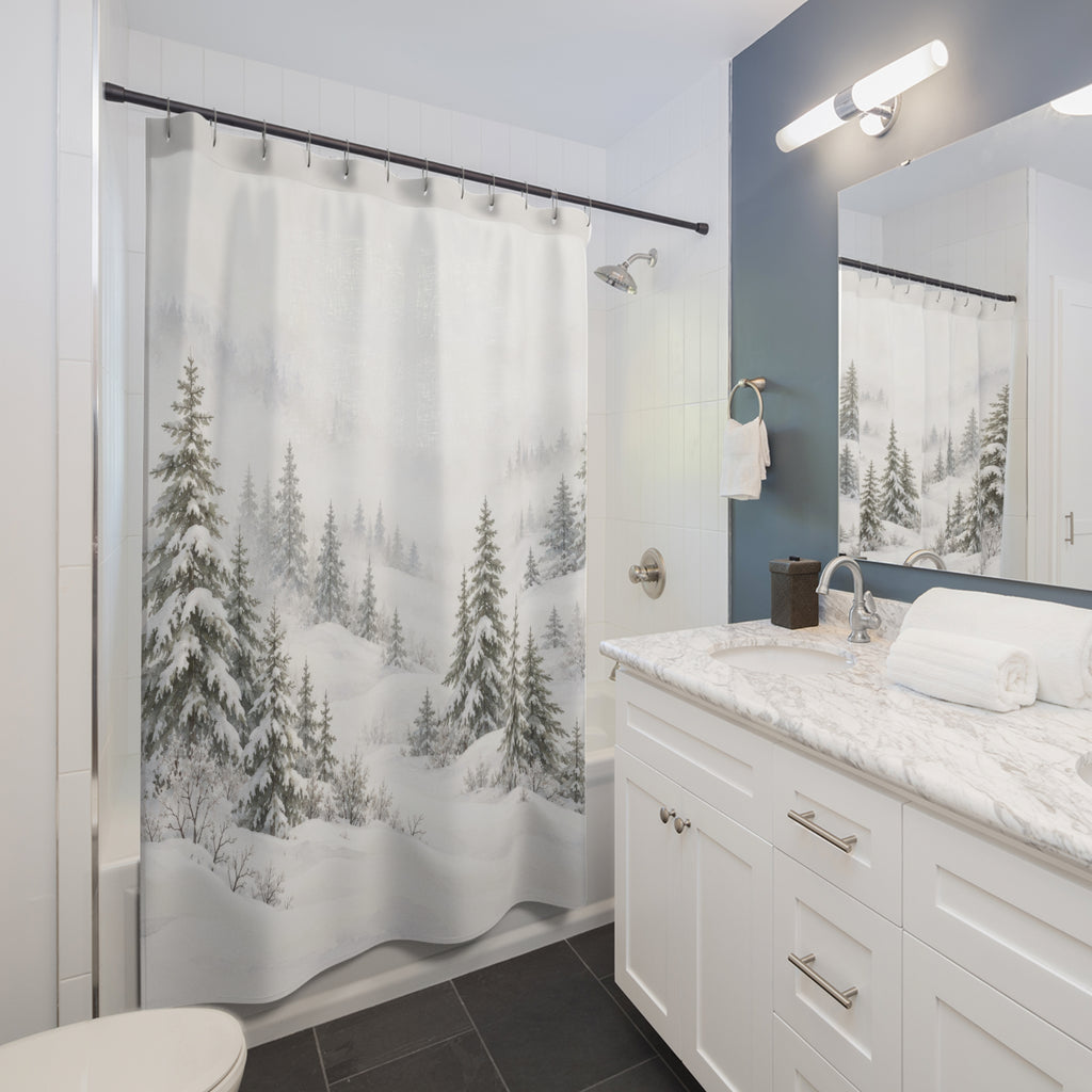 Snow-laden sage-gray pines in white mist and drifts shower curtain beside a white vanity