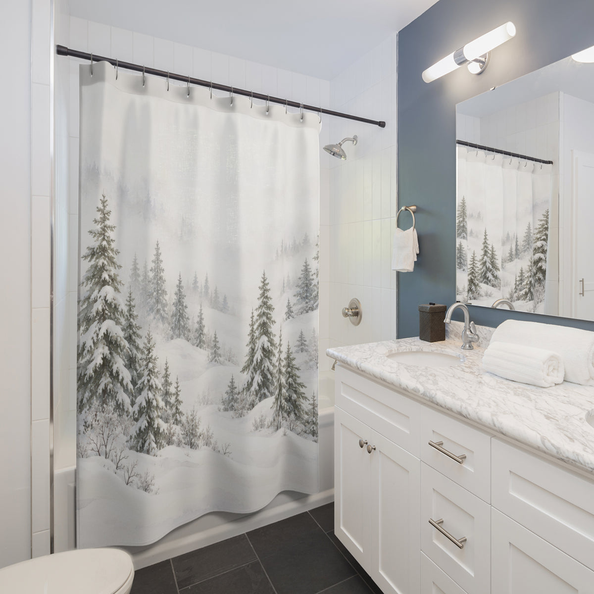 Snow-laden sage-gray pines in white mist and drifts shower curtain beside a white vanity