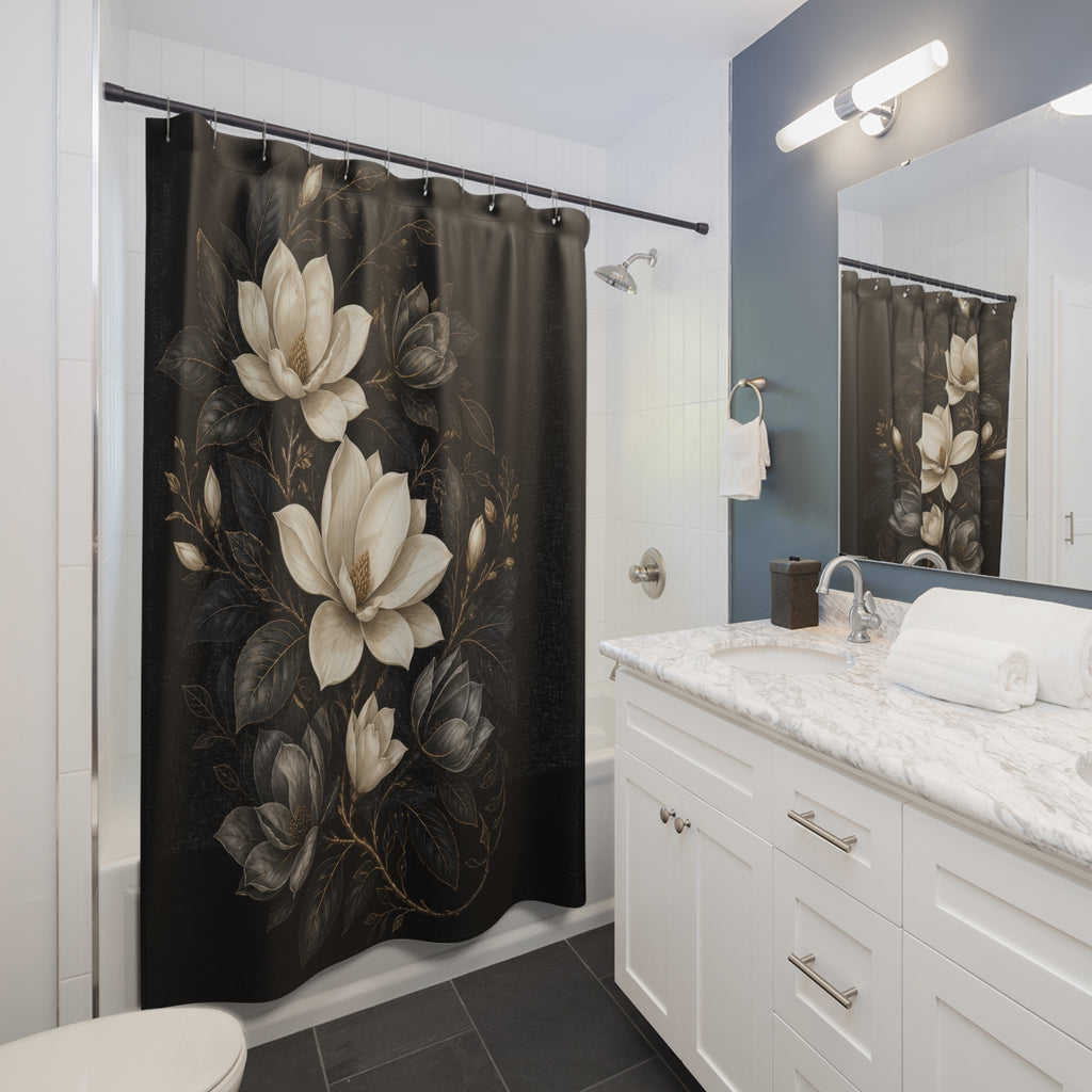 Ivory and charcoal magnolias in an oval medallion on black shower curtain installed beside a white vanity