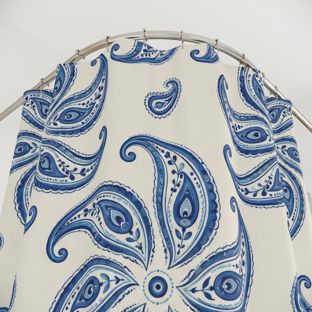 Cobalt blue paisley pinwheel medallions on ivory shower curtain with close-up print, hooks, and folds