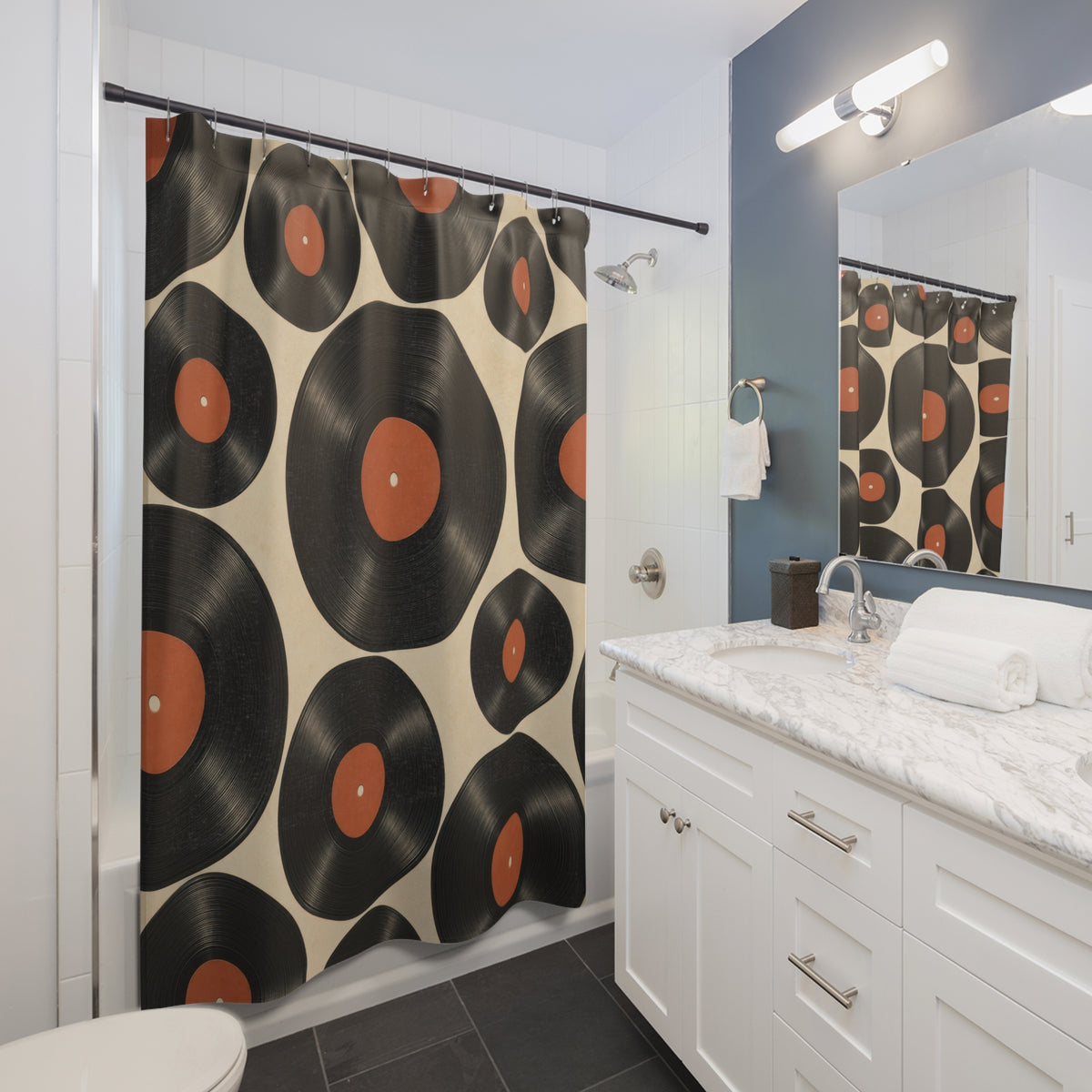 Black and burnt-orange vinyl record pattern shower curtain beside a white vanity