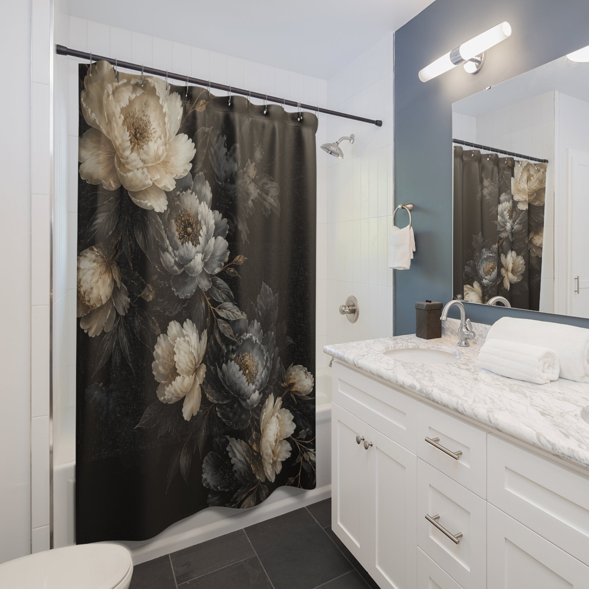 Ivory and smoky grey peonies cascading diagonally on black shower curtain installed beside a white vanity