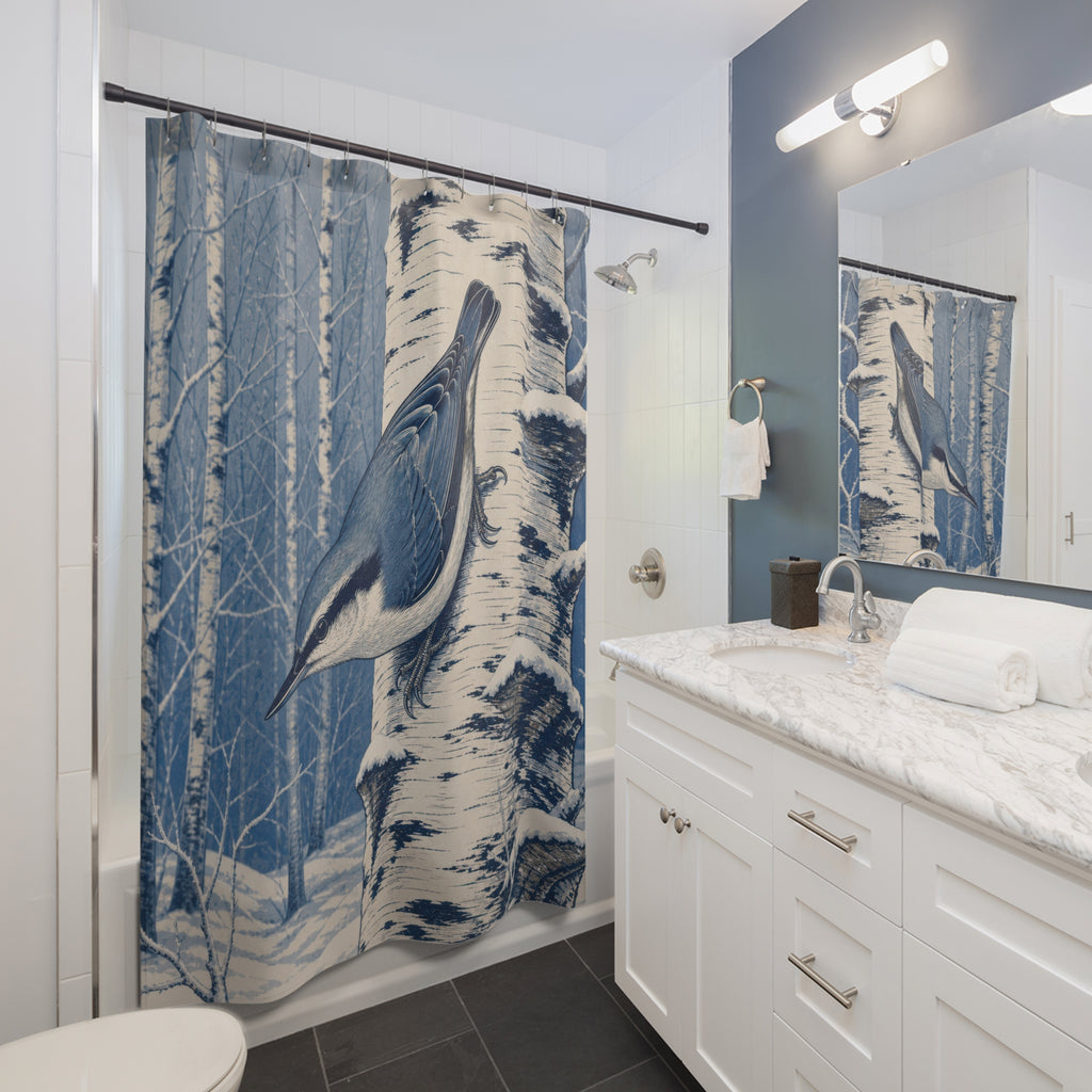 Blue nuthatch on snowy birch shower curtain beside a white vanity