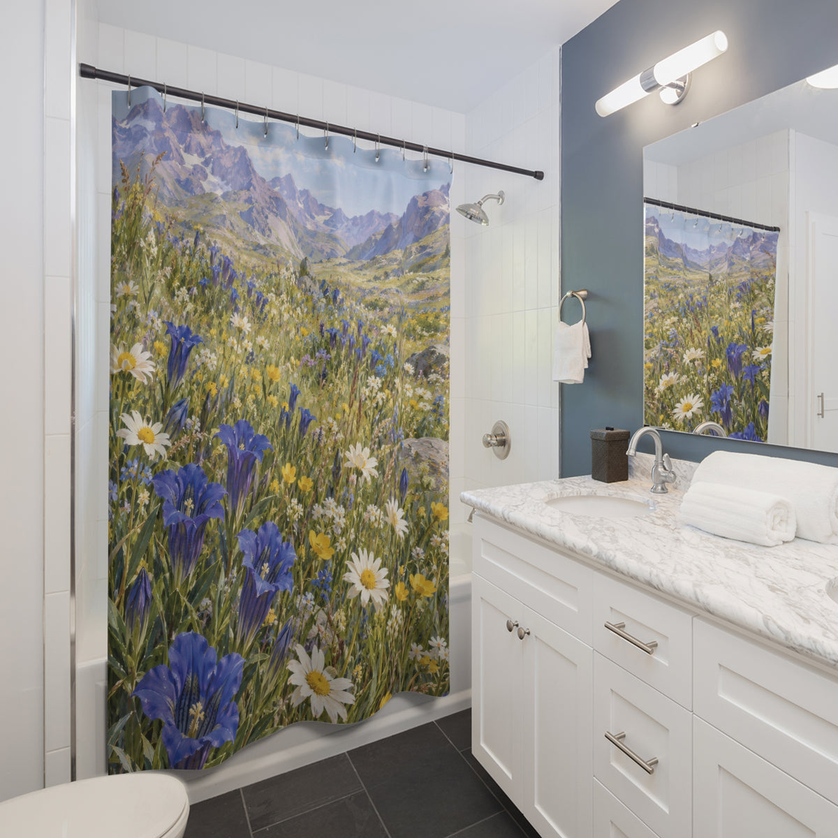 Blue gentians and white daisies beneath lavender mountains shower curtain beside a white vanity