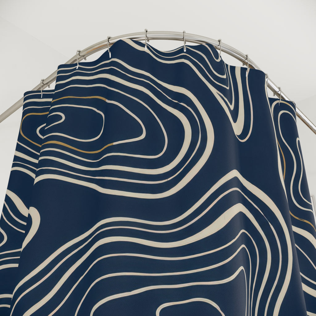 Cream nested contours and ochre accents on navy shower curtain with close-up print, hooks, and folds