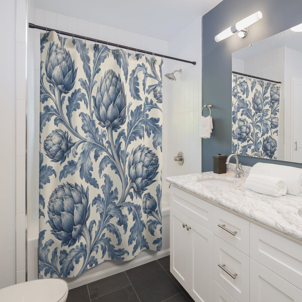 Blue artichokes and curling lobed leaves on cream shower curtain beside a white vanity
