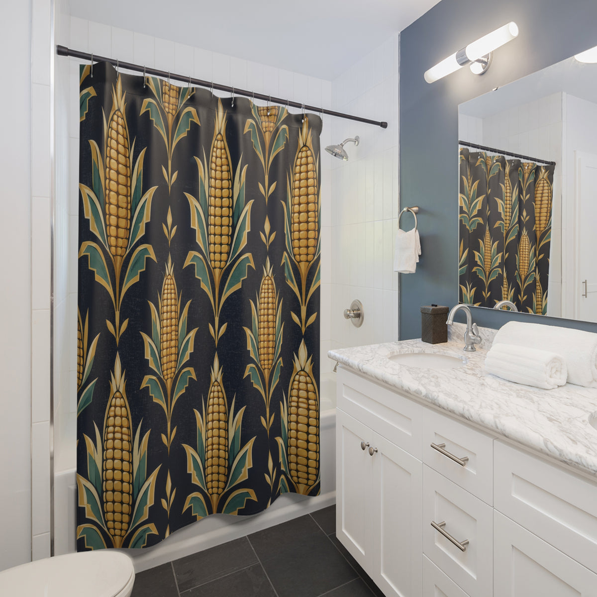 Golden maize with teal husks on navy shower curtain beside a white vanity