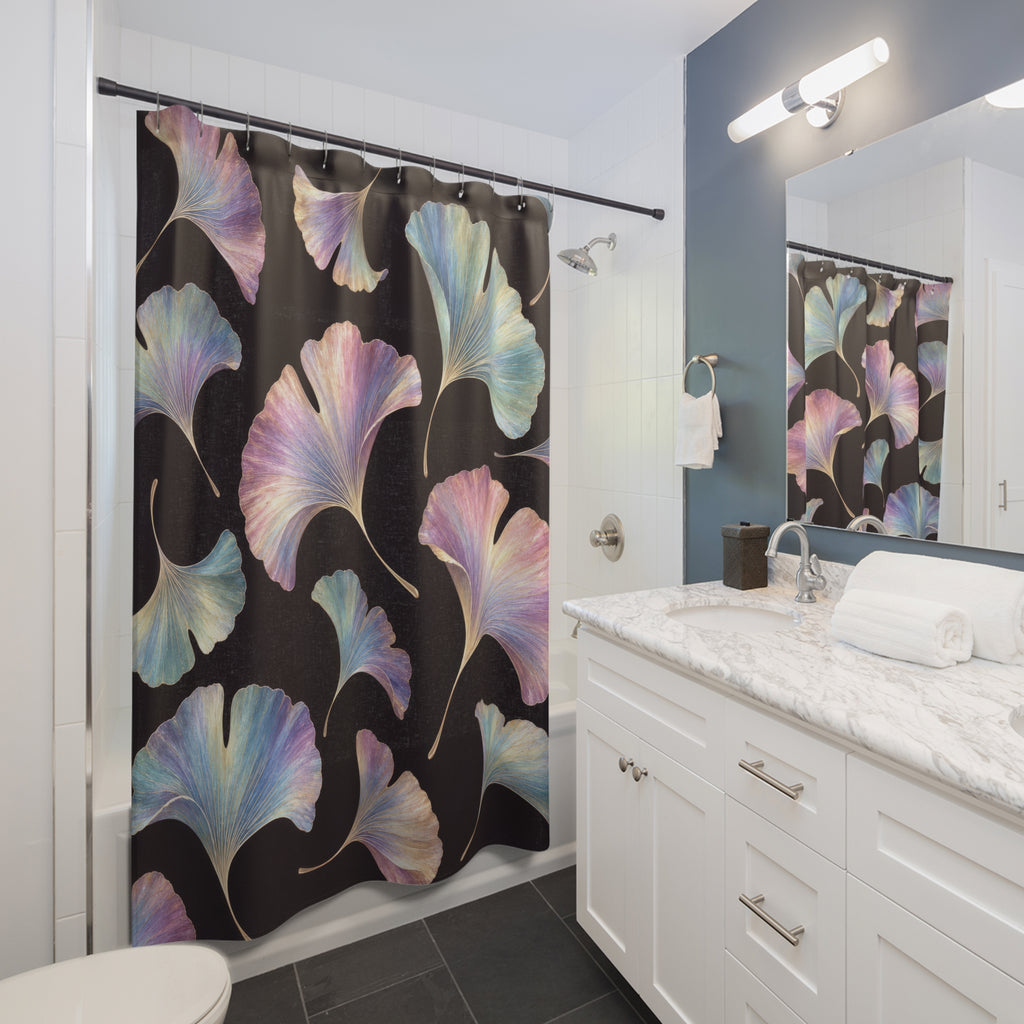 Pastel iridescent ginkgo leaves on a plum-black ground shower curtain beside a white vanity