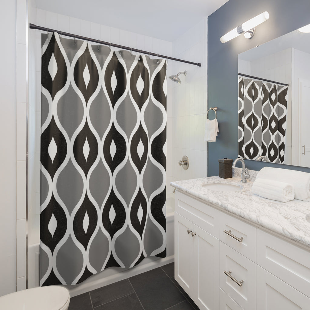 Black and gray ogees with white curved outlines shower curtain beside a white vanity