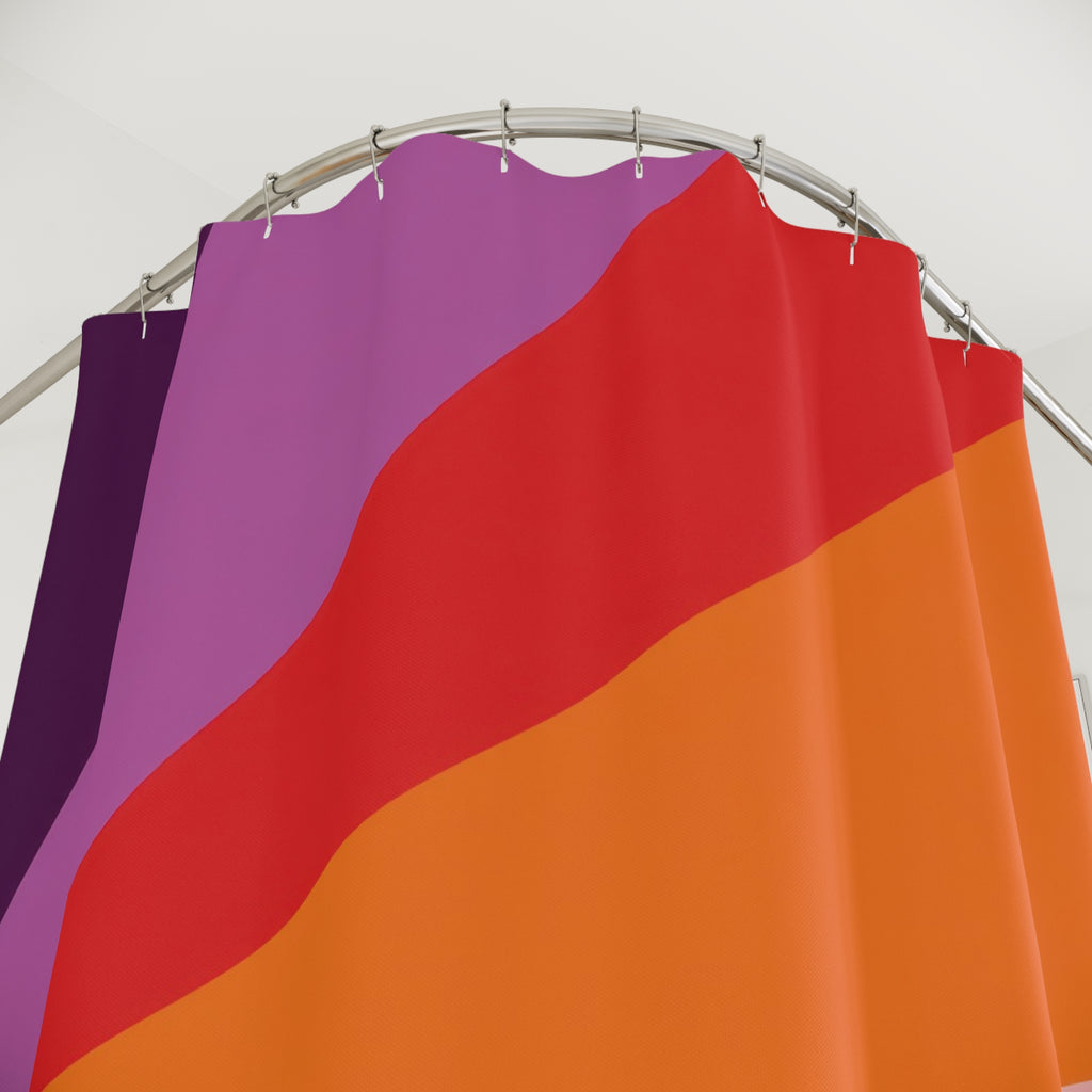 Plum orange and turquoise radial color panels shower curtain with close-up print, hooks, and folds