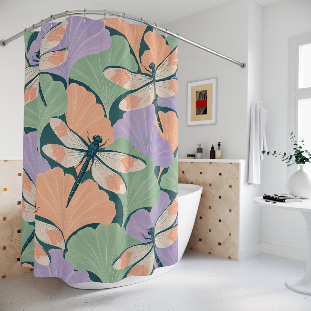 Pastel ginkgo leaves and teal dragonflies shower curtain beside a freestanding tub