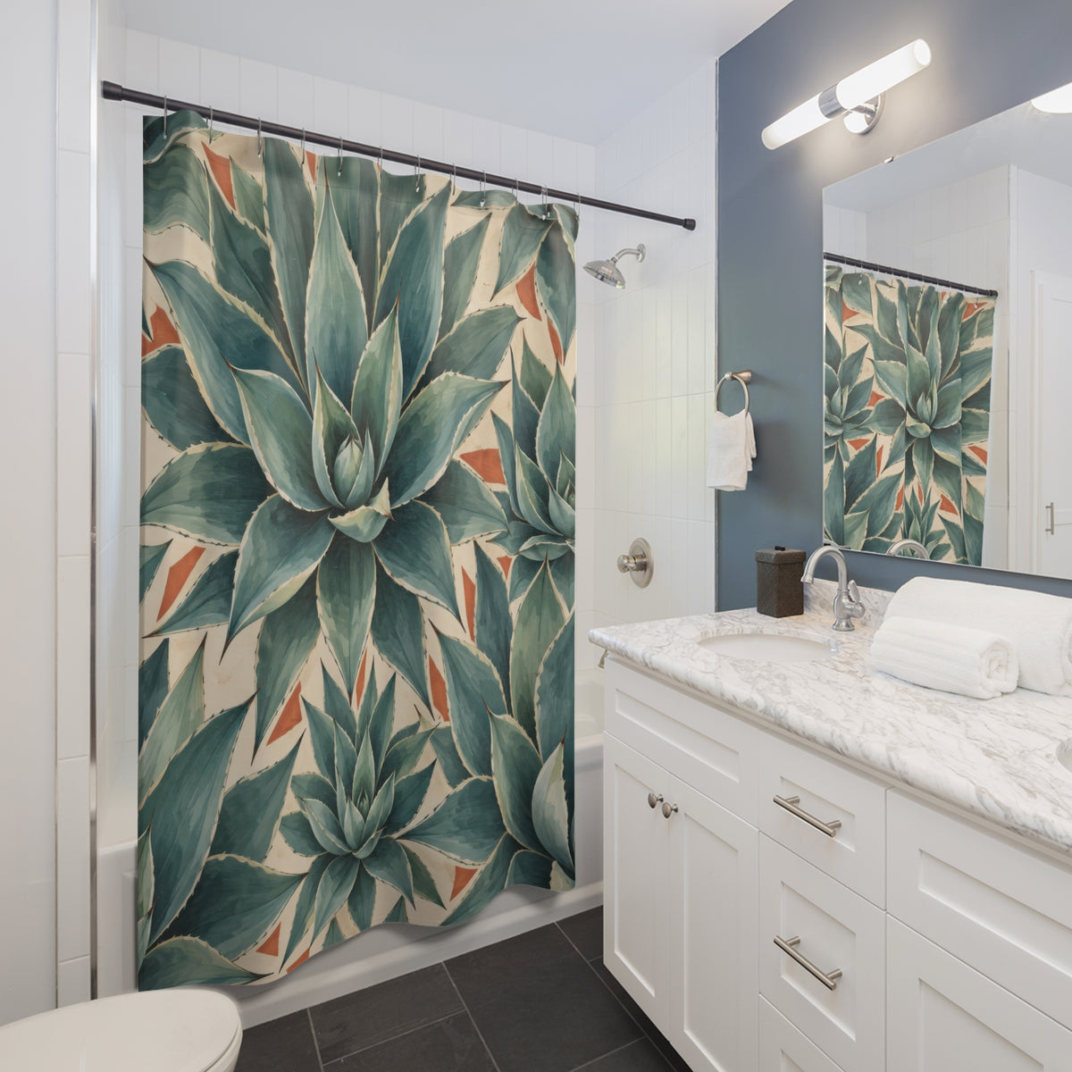 Blue green agave leaves in a geometric tile pattern shower curtain beside a white vanity