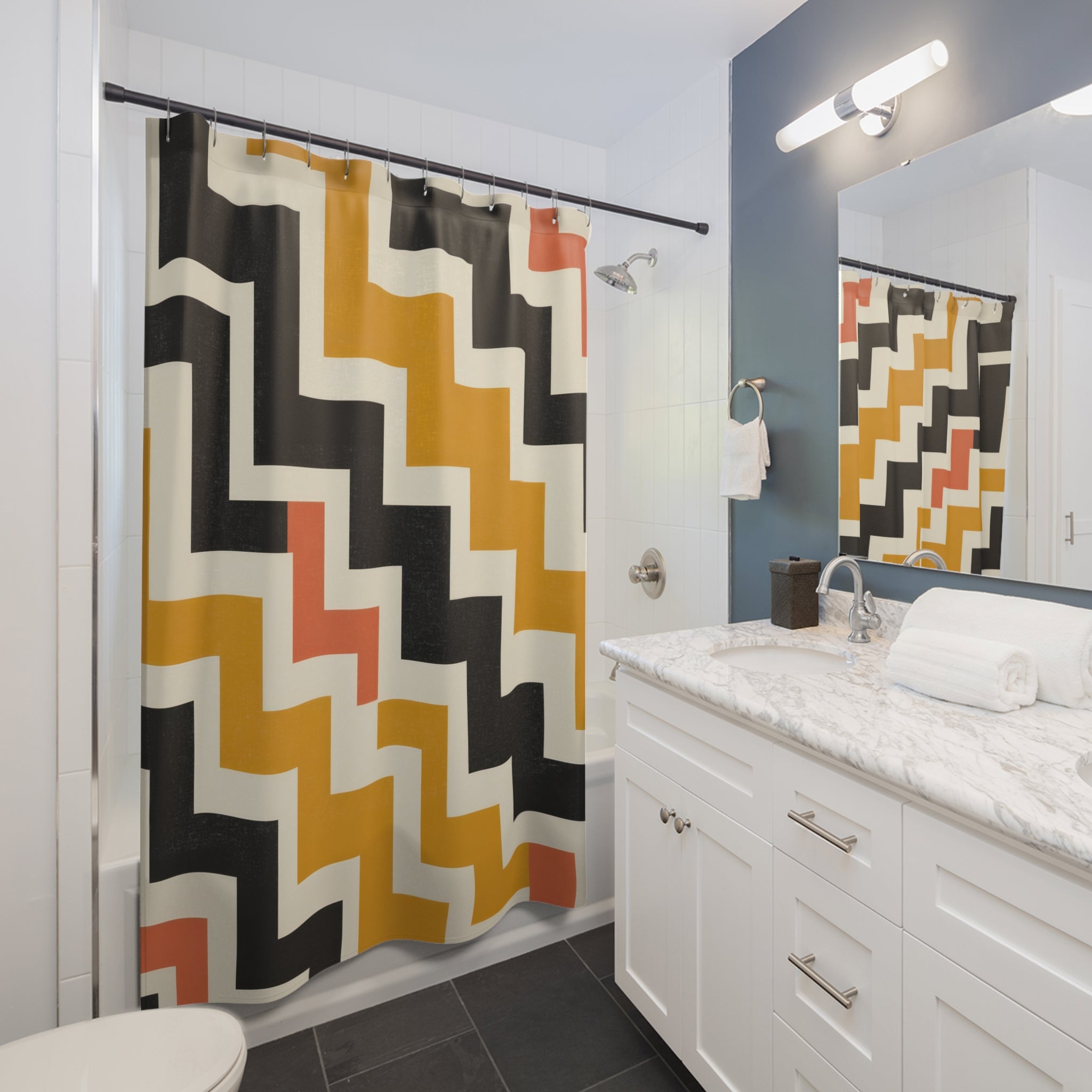 Mustard and black interlocking stepped zigzag labyrinth shower curtain beside a white vanity