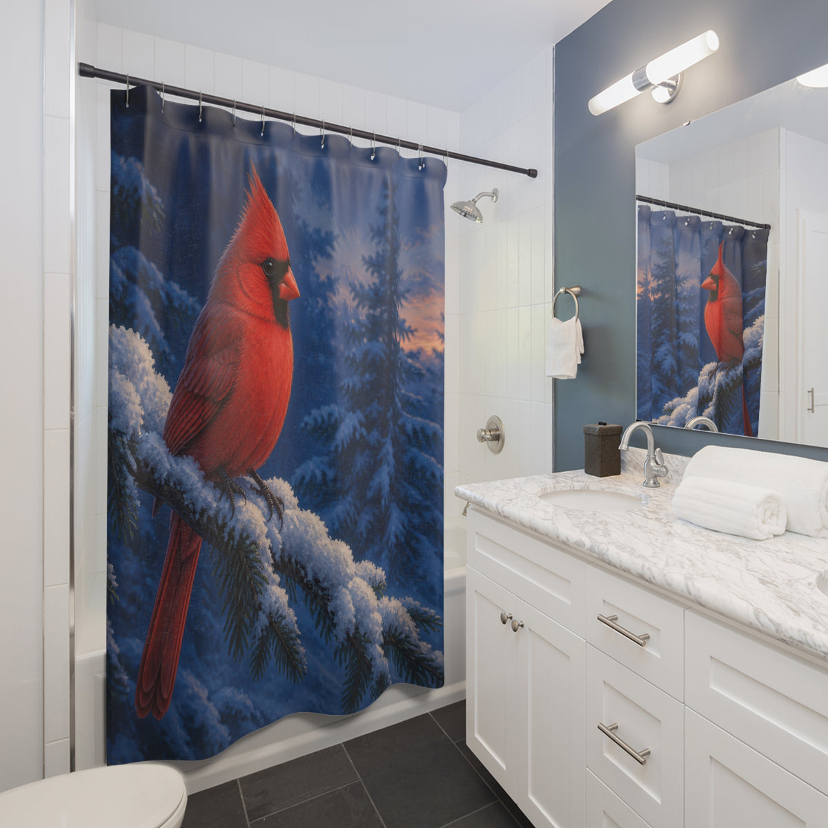 Red cardinal on snowy evergreen shower curtain beside a white vanity
