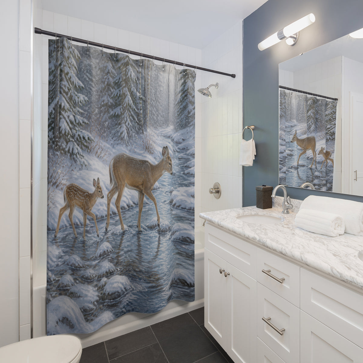 Doe and fawn crossing icy creek shower curtain beside a white vanity