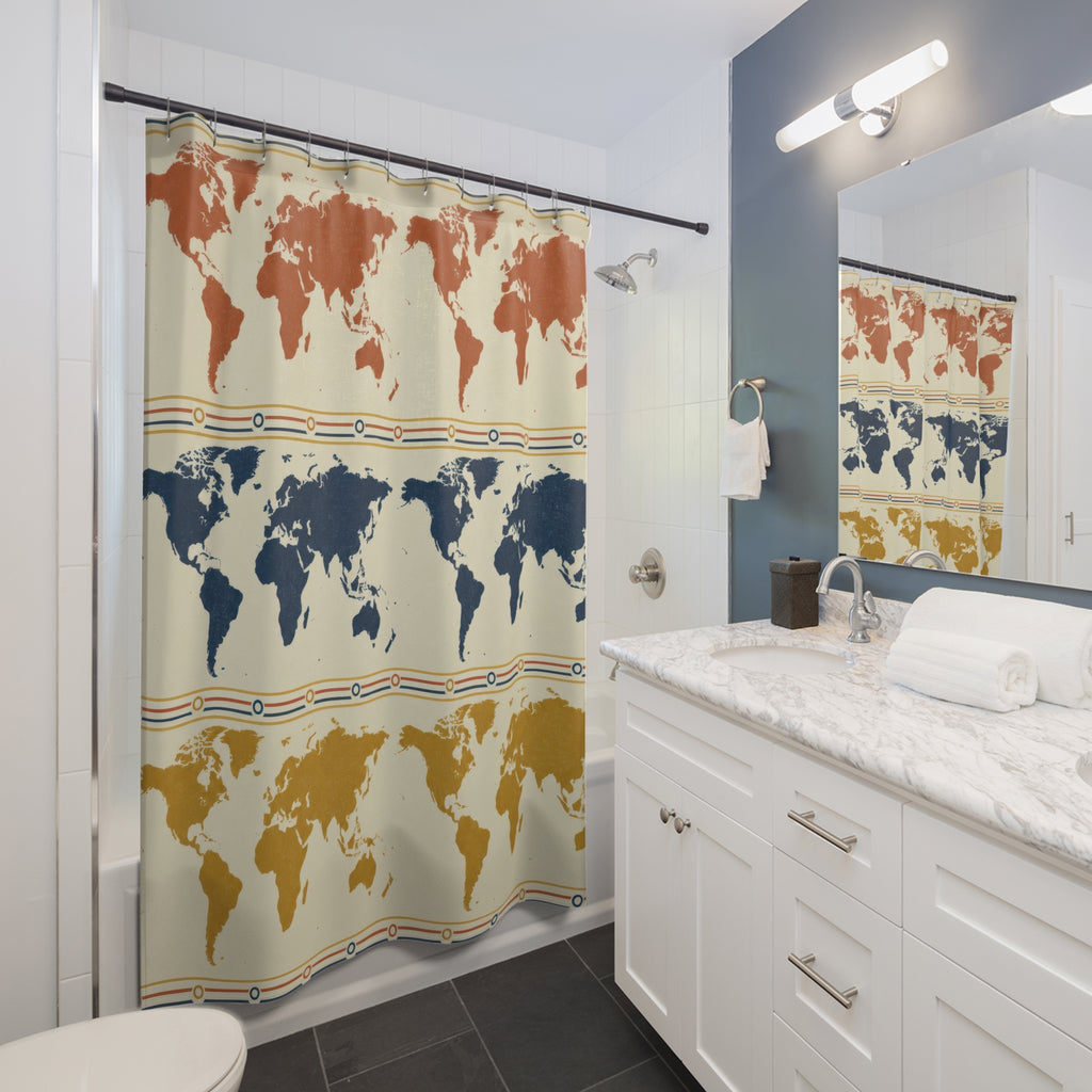 Rust, navy and mustard world maps in repeating rows shower curtain beside a white vanity