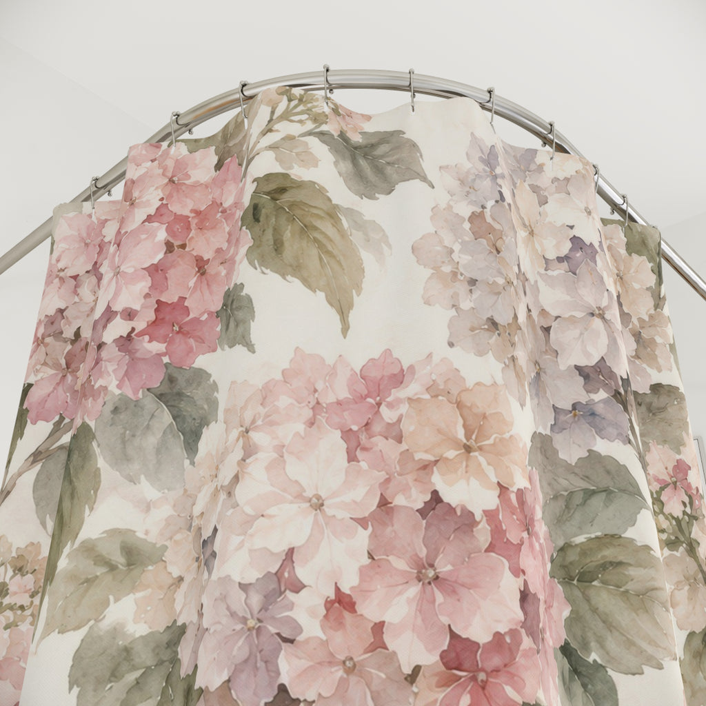 Blush hydrangeas and sage leaves on cream shower curtain with close-up print, hooks, and folds