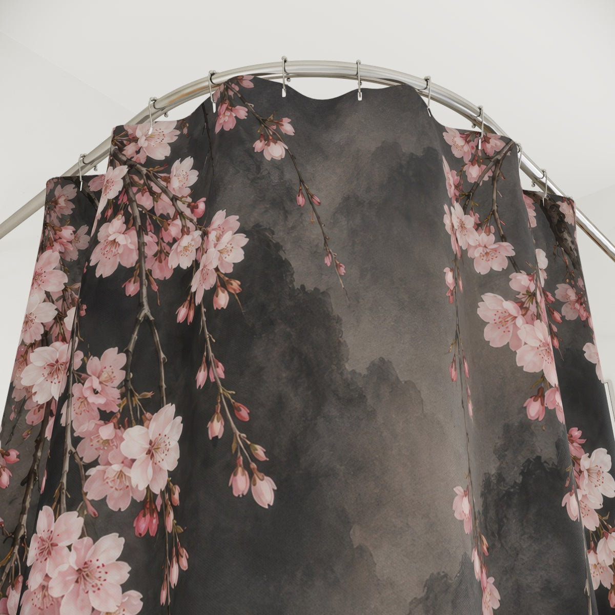 Blush cherry blossom branches on smoky charcoal shower curtain with close-up print, hooks, and folds