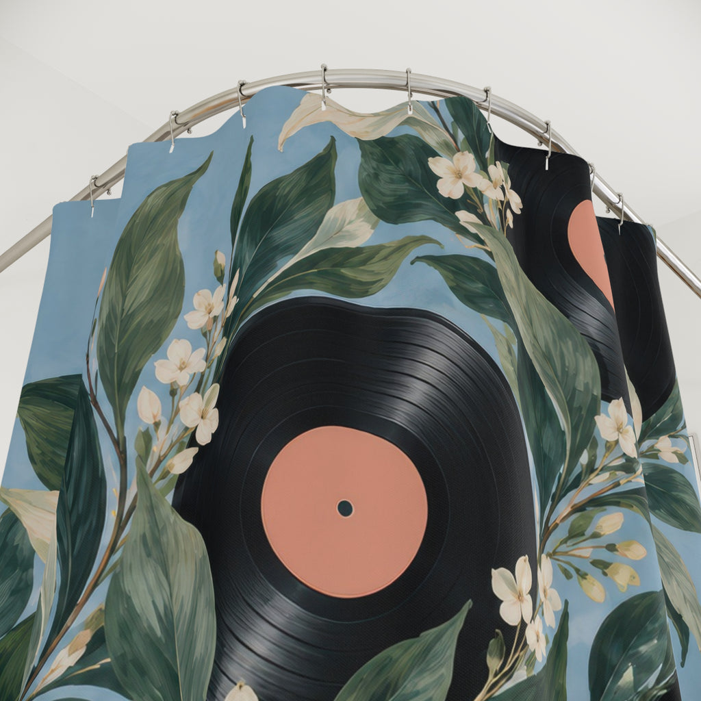 Black vinyl records with green leaves and cream blossoms shower curtain with close-up print, hooks, and folds