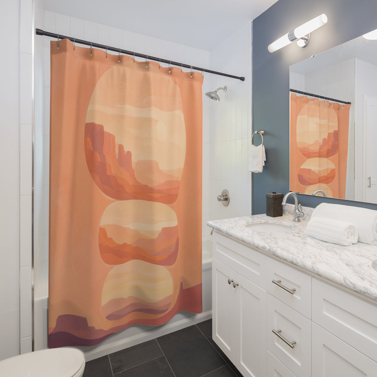 Peach desert canyon portals shower curtain beside a white vanity
