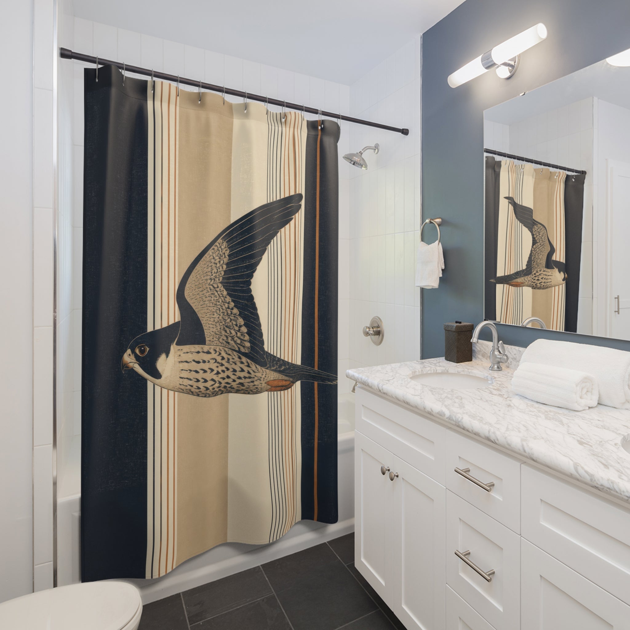 Flying block-print falcon over navy flax and ivory stripes shower curtain installed beside a white vanity