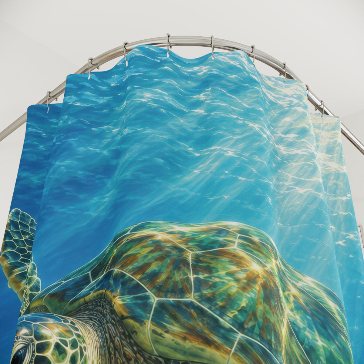 Jade sea turtle and blue underwater sunbeams shower curtain with close-up print, hooks, and folds