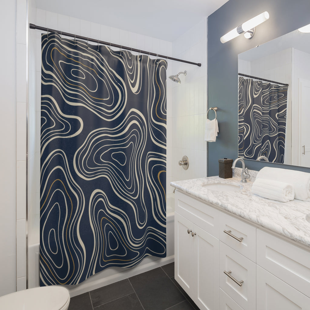 Cream nested contours and ochre accents on navy shower curtain beside a white vanity
