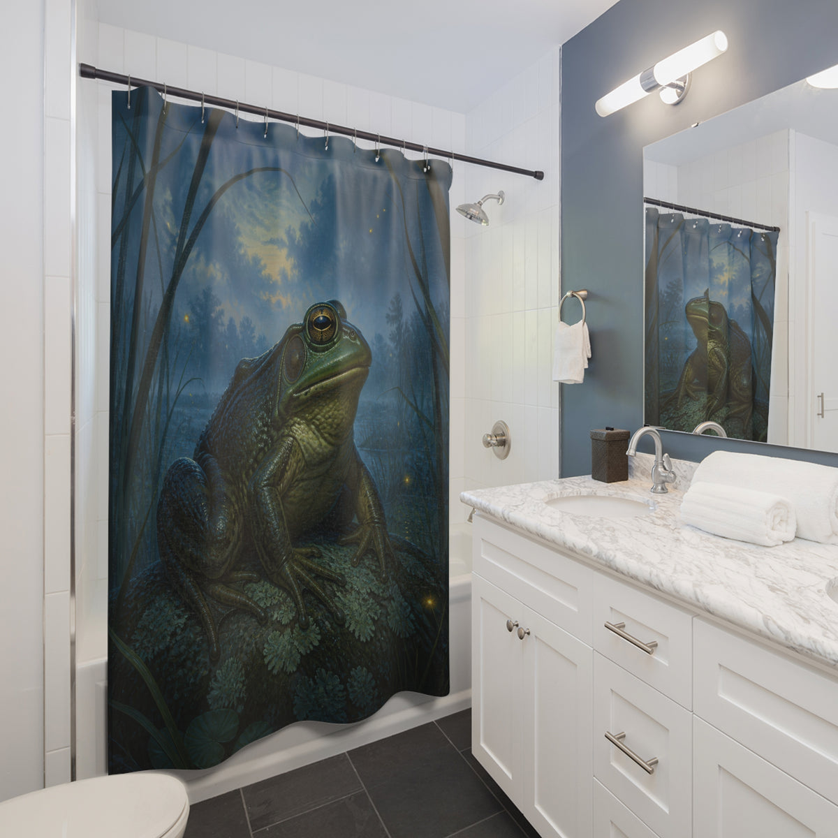 Bullfrog resting in a moonlit blue marsh shower curtain beside a white vanity