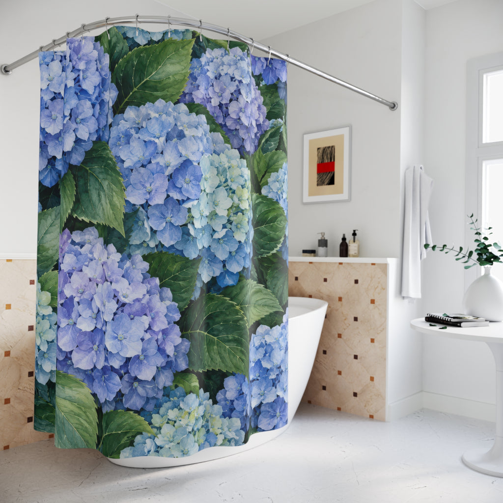 Blue hydrangea clusters among broad green leaves shower curtain beside a freestanding tub
