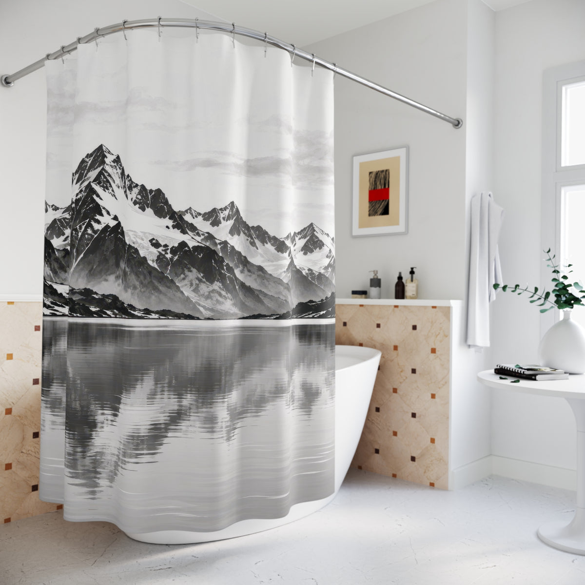 Snowy black and gray mountains reflected in a pale lake shower curtain beside a freestanding tub