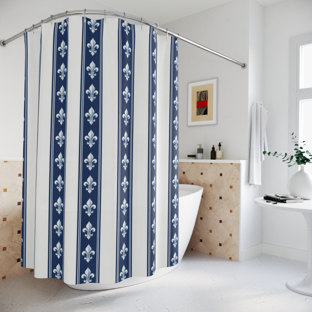 White fleur-de-lis motifs in navy and white vertical bands shower curtain beside a freestanding tub