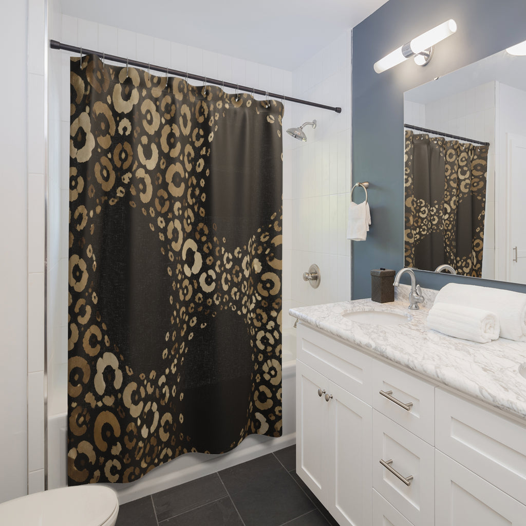 Champagne cheetah print around black portals shower curtain beside a white vanity