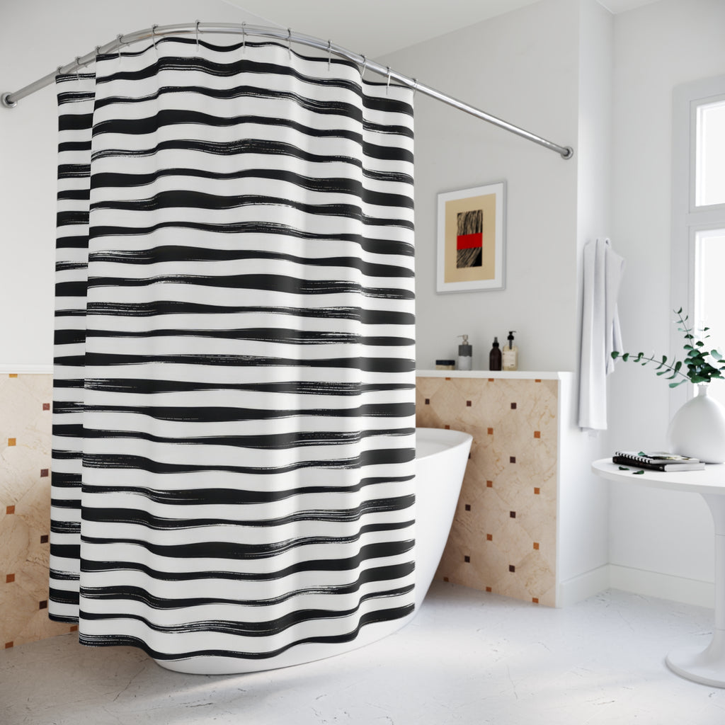 Horizontal black brush stripes with white dry-ink streaks shower curtain beside a freestanding tub