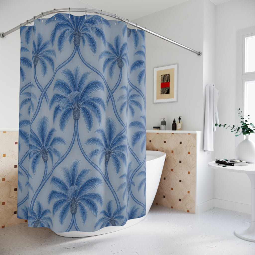 Blue palm trees with interlaced trunks on pale blue shower curtain beside a freestanding tub