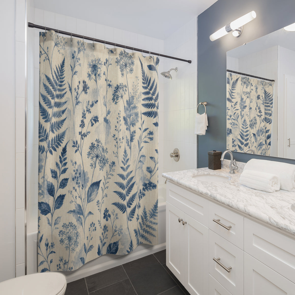 Blue Botanical cyanotype farmhouse white shower curtain beside a white vanity