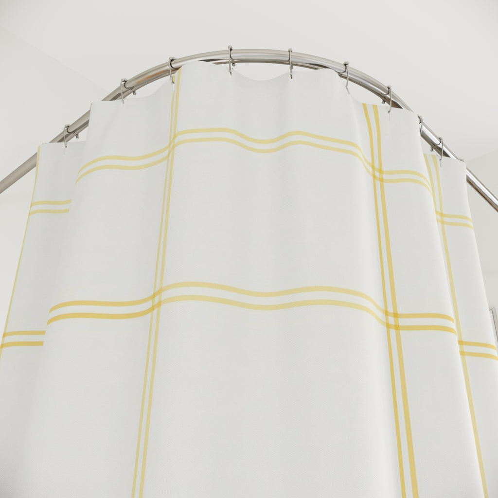 Pale lemon windowpane check on warm white shower curtain with close-up print, hooks, and folds