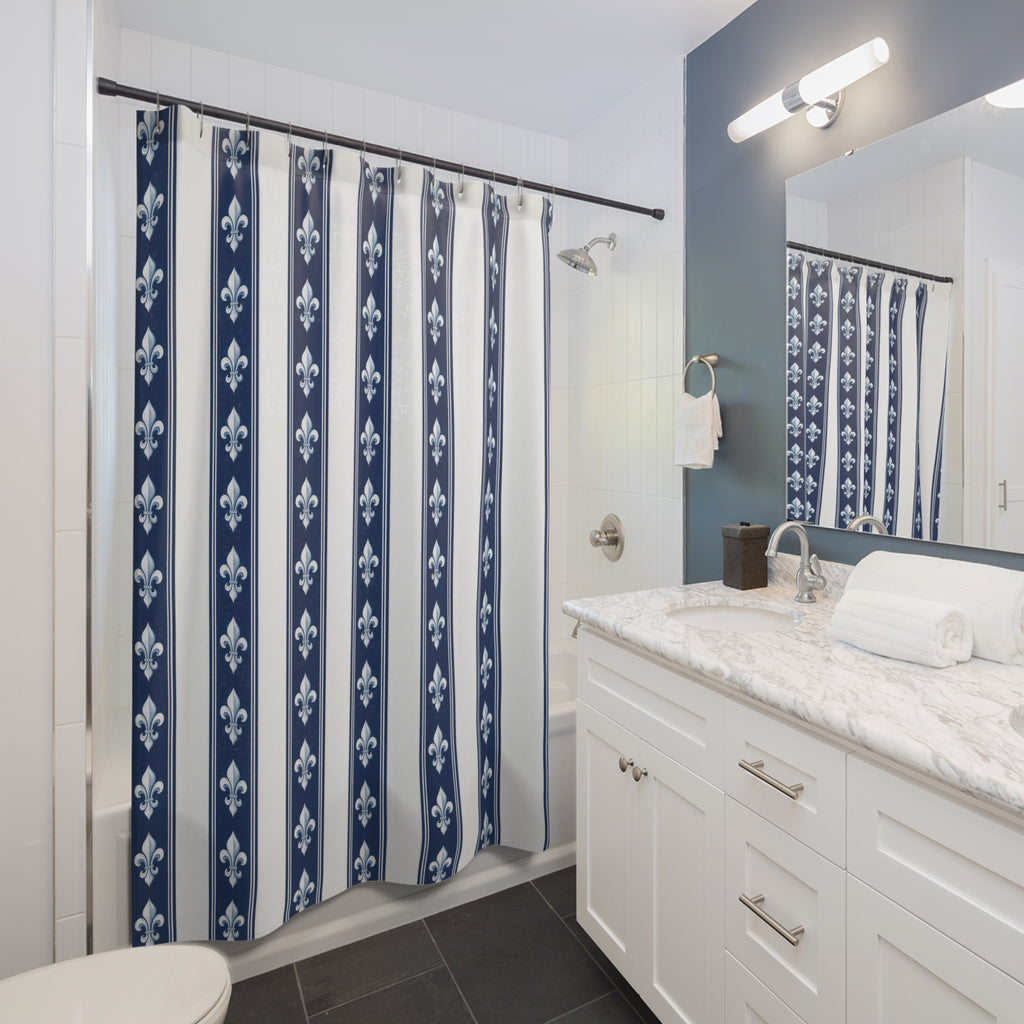 White fleur-de-lis motifs in navy and white vertical bands shower curtain beside a white vanity